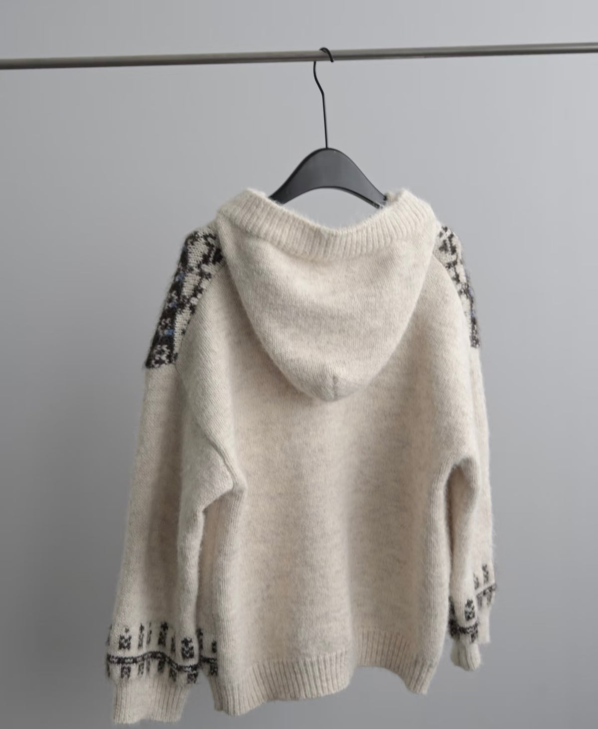Cream Nordic Fair Isle hooded knit cardigan, wool & alpaca blend, with dark patterned sleeves.