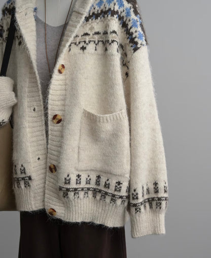 Knitted cardigan with a pattern on a plain background